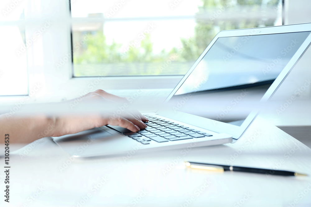 Woman hands working on computer at desk Woman hands working on computer at desk