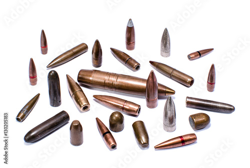 Bullets of various calibers on white background