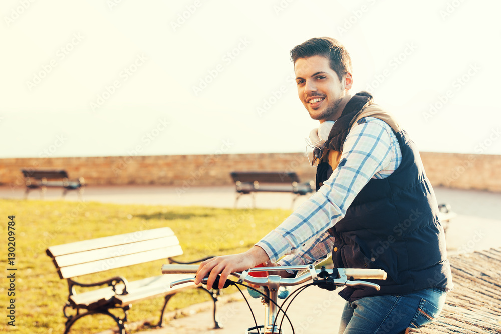 Young man riding bike