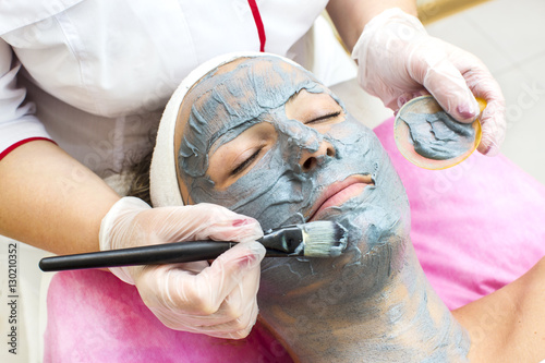 Process of massage and facials in beauty salon photo