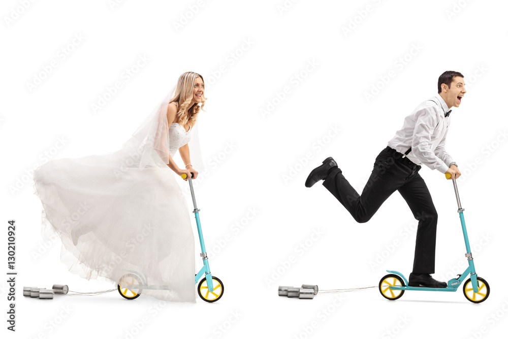 Newlywed bride and groom riding scooters Newlywed bride and groom riding scooters