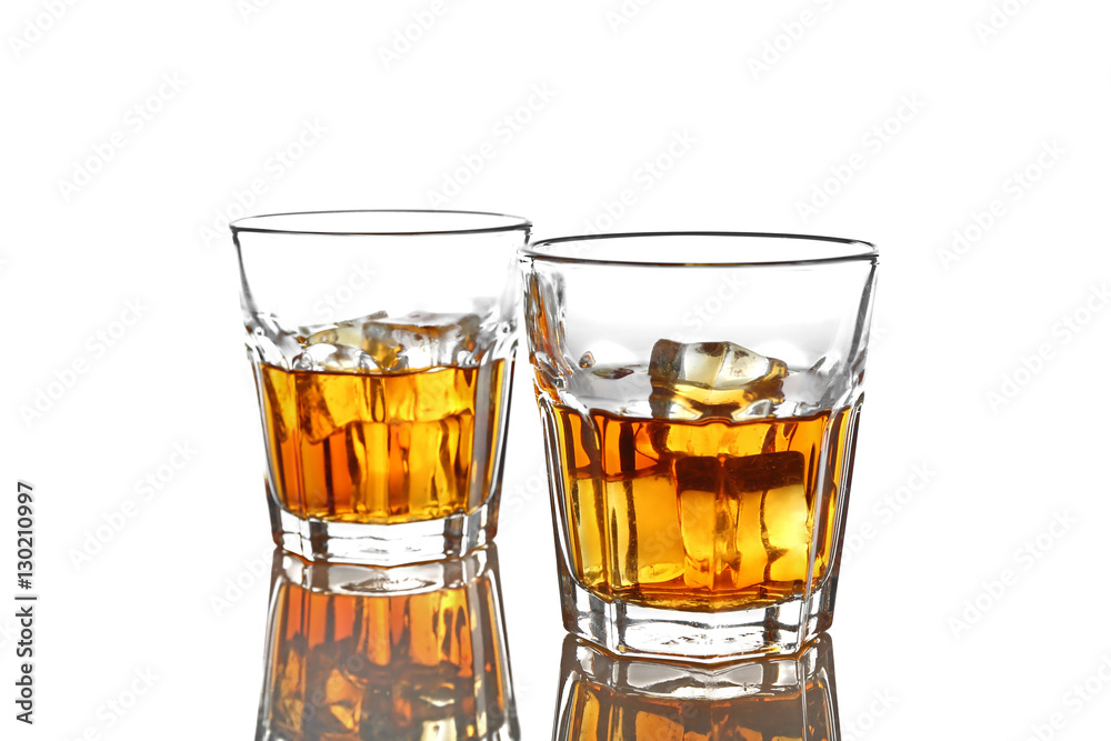 Glasses of whisky with ice isolated on white Glasses of whisky with ice isolated on white