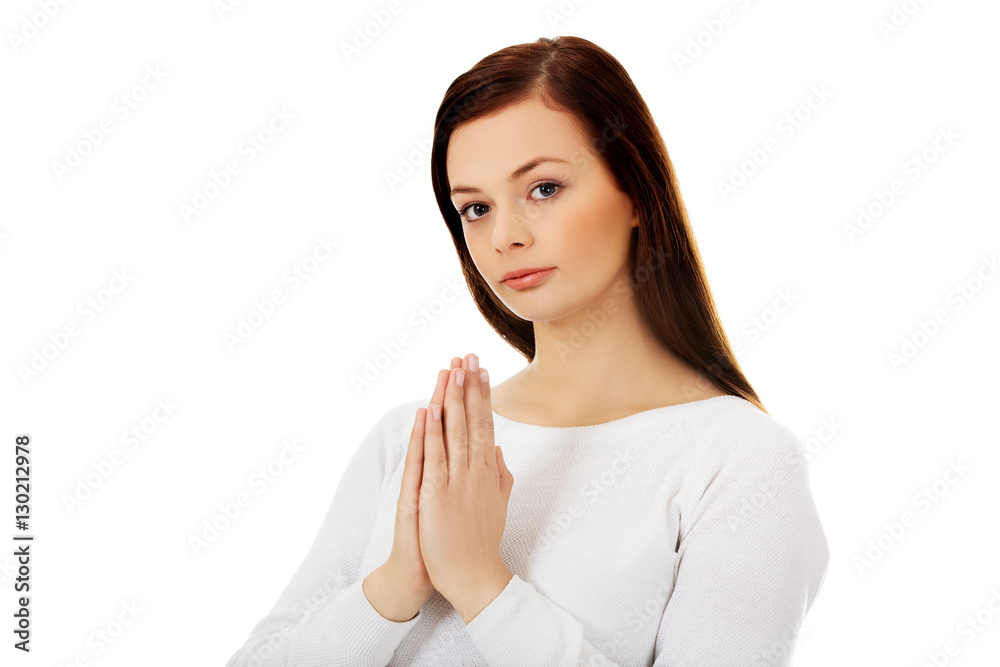 Beautiful young caucasian woman praying Beautiful young caucasian woman praying