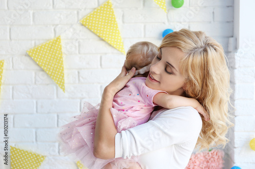 Portrait of happy mother an...