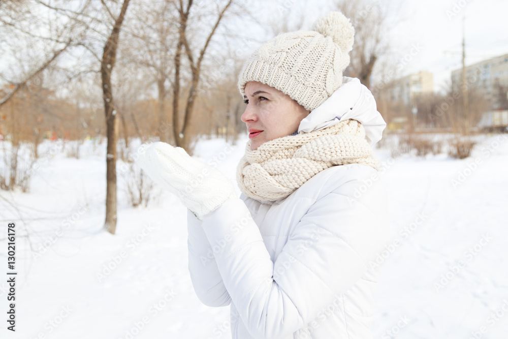 The girl in a winter white down-padded coat The girl in a winter white down-padded coat