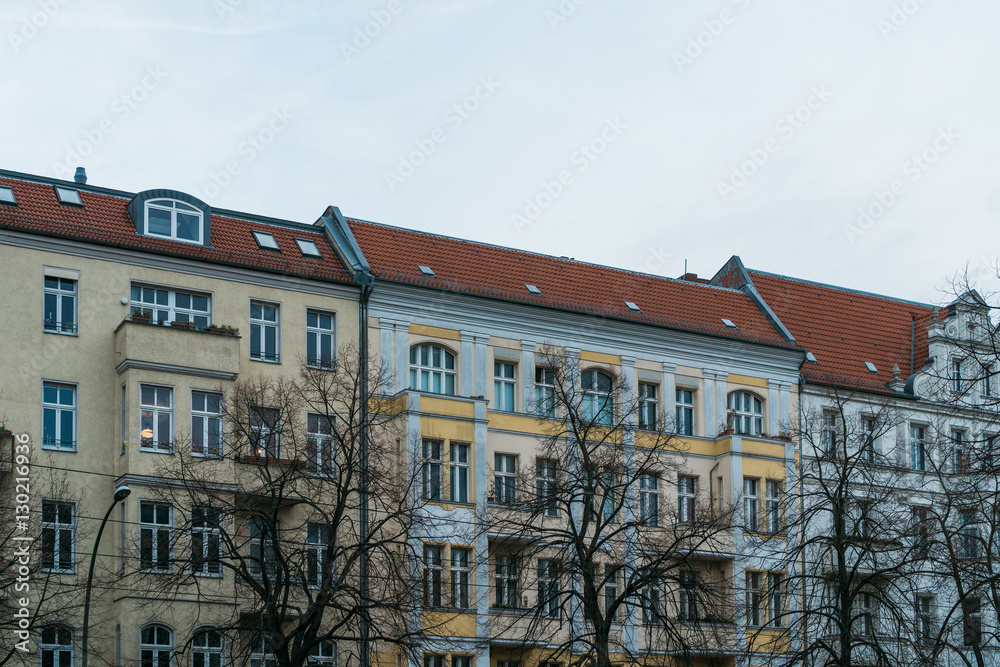 Fototapeta premium yellow and blue facaded row houses at berlin