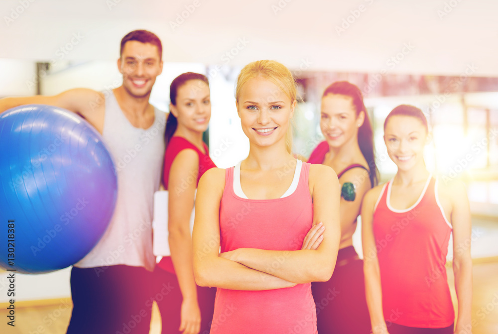 woman standing in front of the group in gym