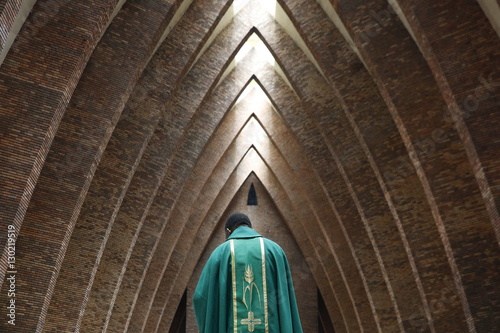 Priest during Catholic Mass, St. Anne's Basilica, Brazzaville, Congo photo