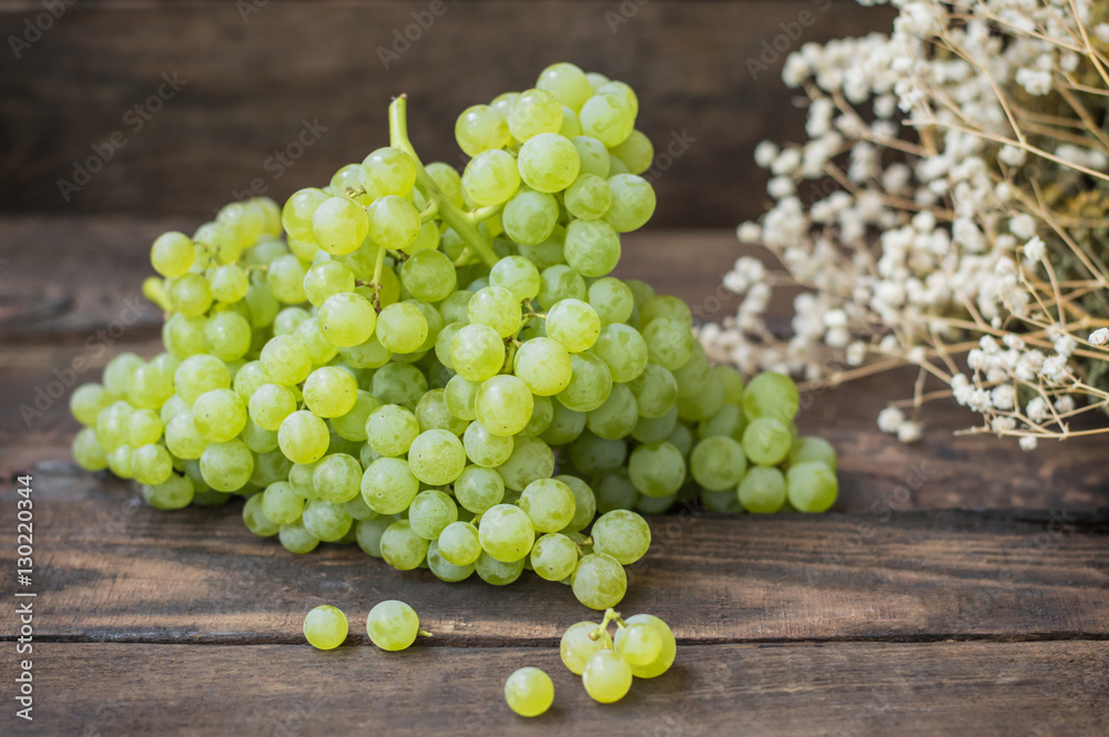 Sultan Grapes on a wooden background. Close-up. Selective focus Sultan Grapes on a wooden background. Close-up. Selective focus