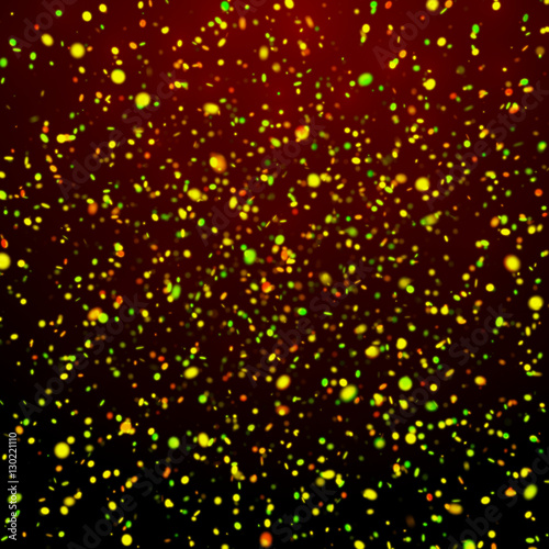 festive glitter background: twinkling falling glitter in shades of gold, green and red 