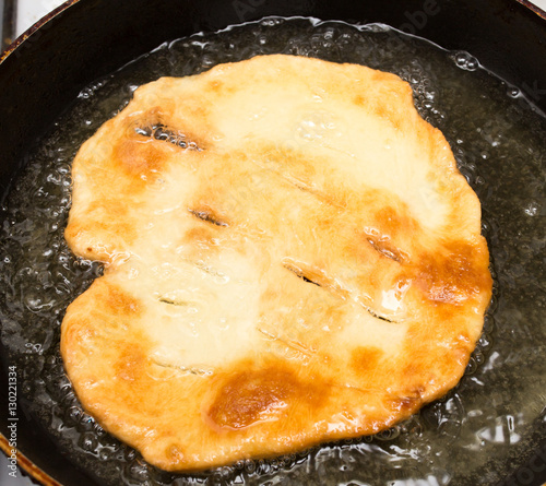 tortilla is fried in a pan