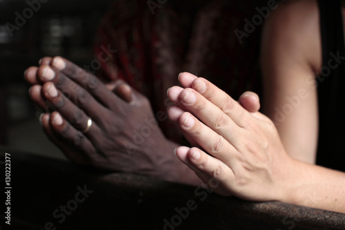 Man and woman praying together in a church, Cotonou, Benin, West Africa