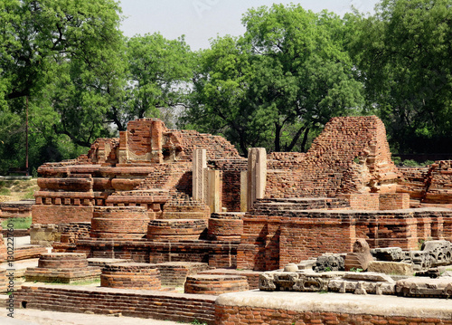 Ruins of ancient buildings, temple and Buddhist stupas of the ancient city of Sarnath - the place of the Buddha's first sermon near Benares, India