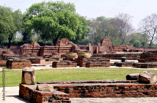 A view of the ruins of old buildings and Buddhist stupas of the ancient city of Sarnath near Varanasi, India