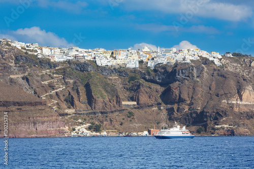 SANTORINI, GREECE - OCTOBER , 2015: The passengers ship and Fira town in the background.