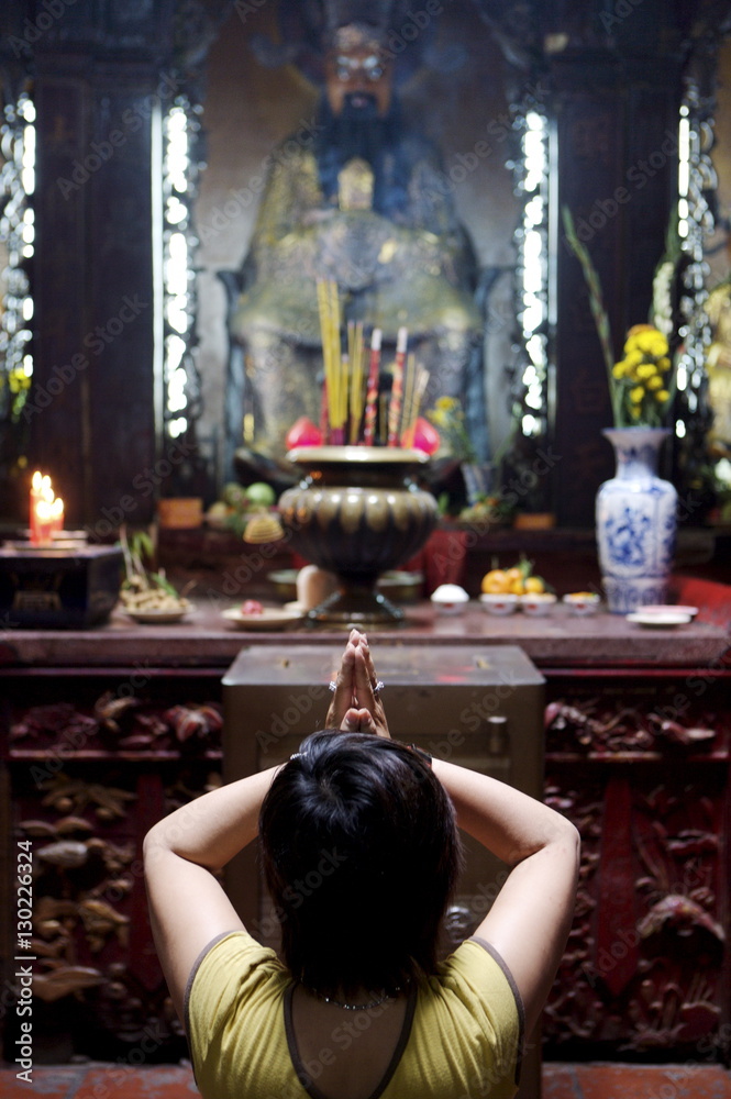 Local woman praying and meditating in front of offerings in Buddhist temple, Ho Chi Min City, Vietnam
Local woman praying and meditating in front of offerings in Buddhist temple, Ho Chi Min City, Vietnam