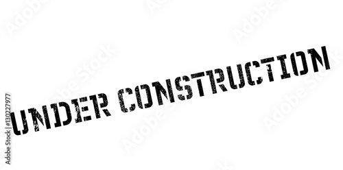 Under construction rubber stamp. Grunge design with dust scratches. Effects can be easily removed for a clean, crisp look. Color is easily changed.