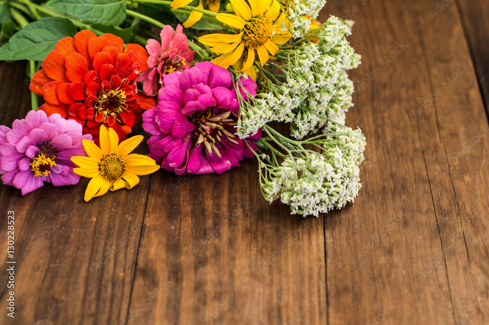 Wild flowers on a wooden background