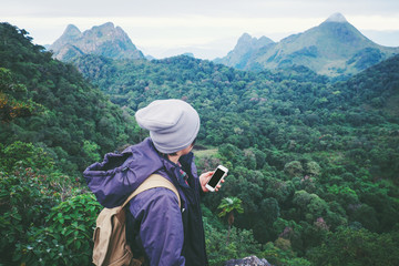  young man traveler He is using mobile phone travel concept