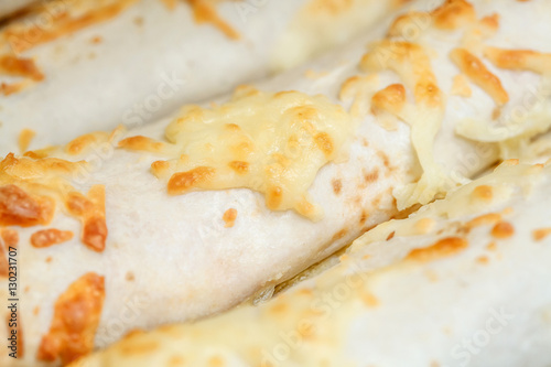Close-up of shaurma covered with cheese, macro view © hdesert