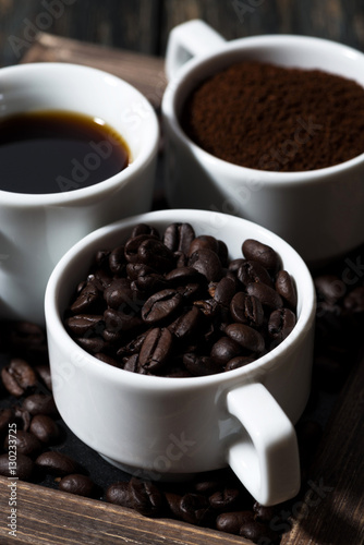 Three types of coffee - ground  grain and beverage  vertical 