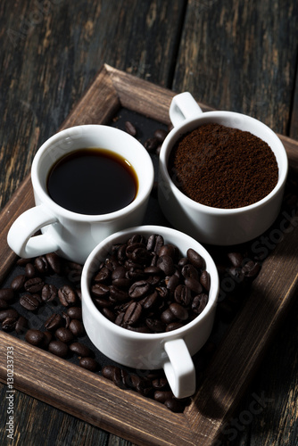 Three types of coffee - ground, grain and beverage, vertical