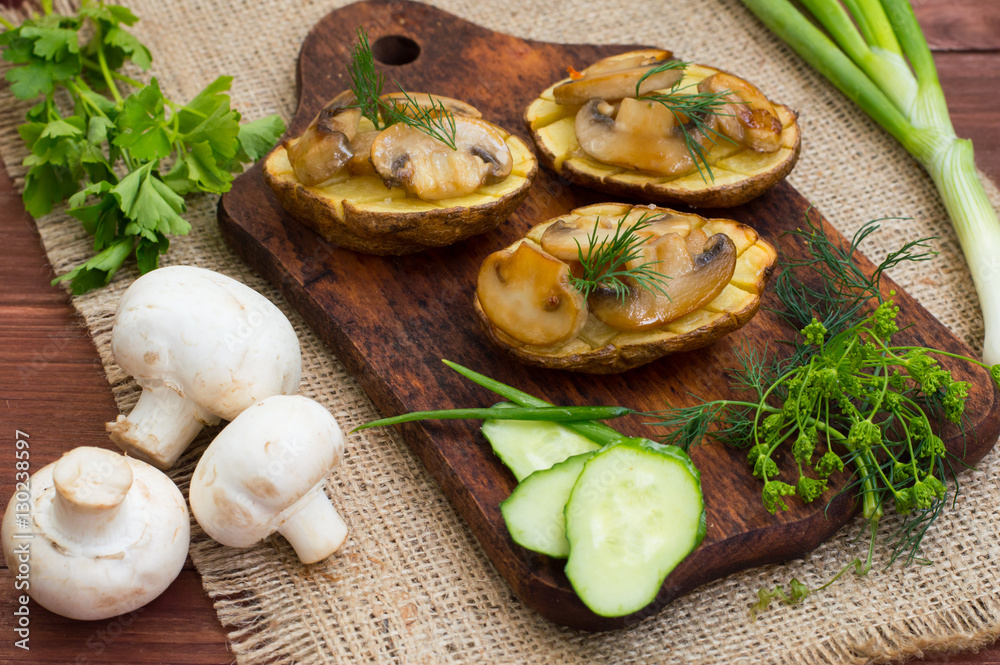 Baked potatoes with fried mushrooms. Top view. Close-up Baked potatoes with fried mushrooms. Top view. Close-up