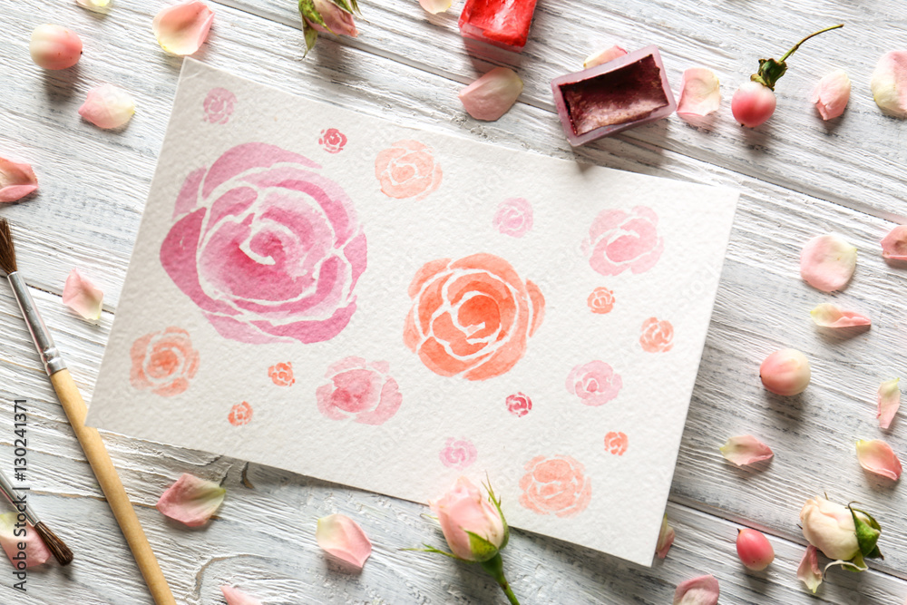 Watercolor painting with flowers on wooden table Watercolor painting with flowers on wooden table