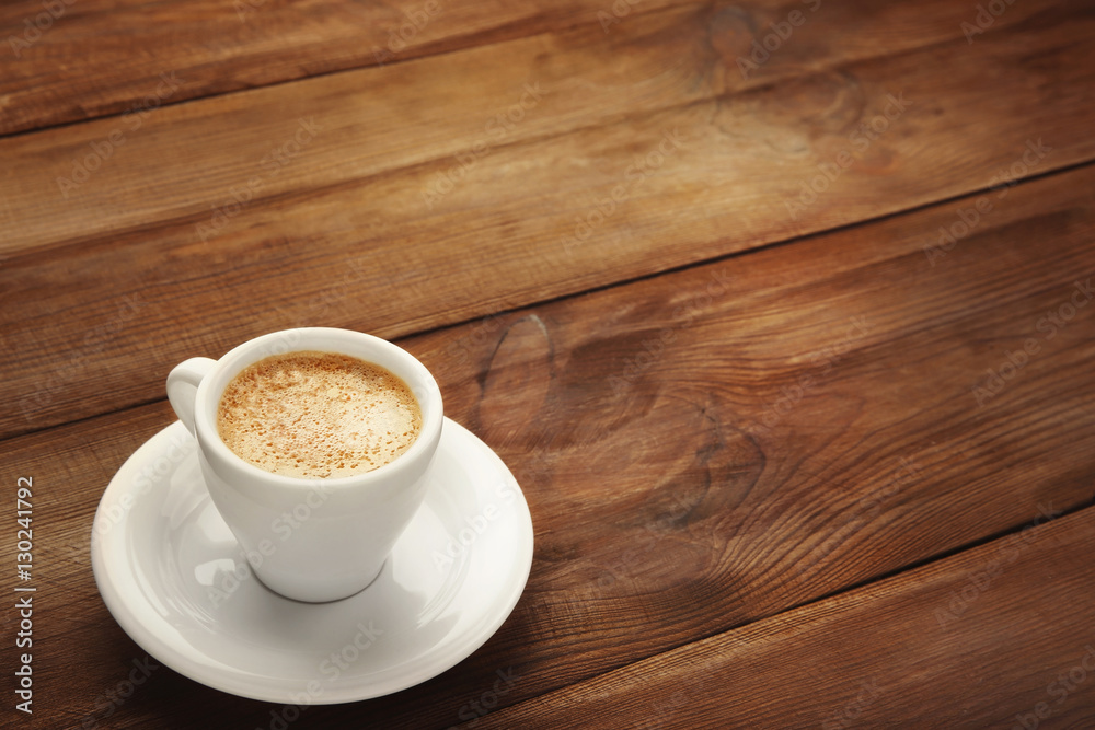 Fototapeta premium Cup of coffee on wooden background
