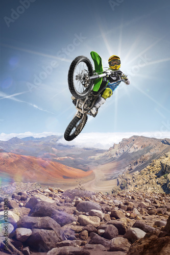 Dirt bike rider flying high on the top of vulcan