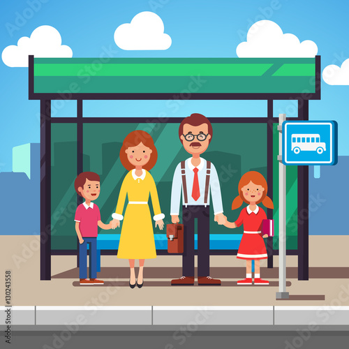 Family waiting for transit on a city bus stop