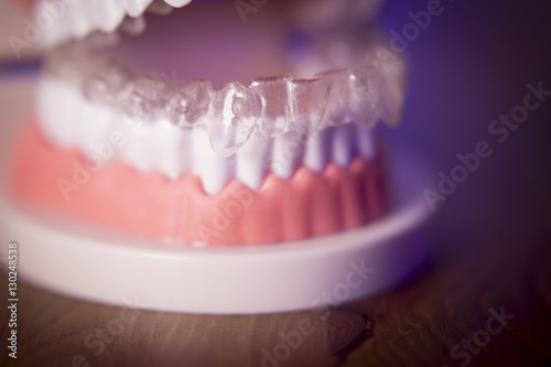 Denture with transparent orthodontics