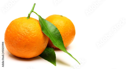 Mandarin, tangerine citrus fruit, with green leaf, isolated on white background.