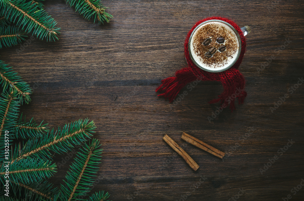 Coffee cup with cinnamon and fir on dark background Coffee cup with cinnamon and fir on dark background