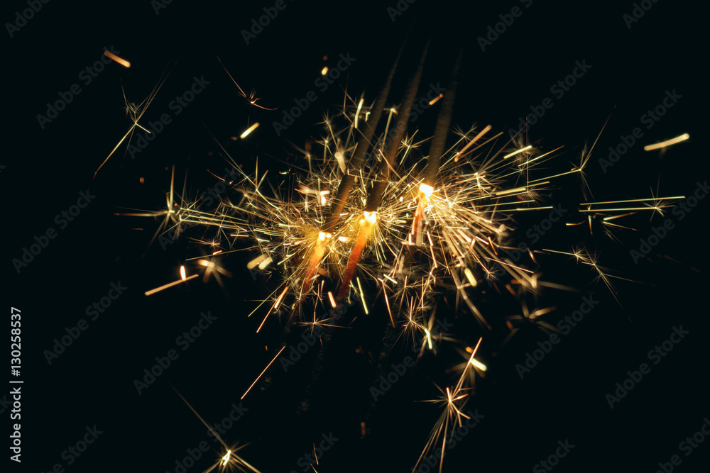 Party Sparkler on Dark Background. Holiday Fireworks on Black. New Year Eve or Christmas Party Sparkler on Dark Background. Holiday Fireworks on Black. New Year Eve or Christmas