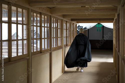 Monk inside Eiheiji Temple, headquarters of the Soto sect of Zen Buddhism, Fukui, Japan photo