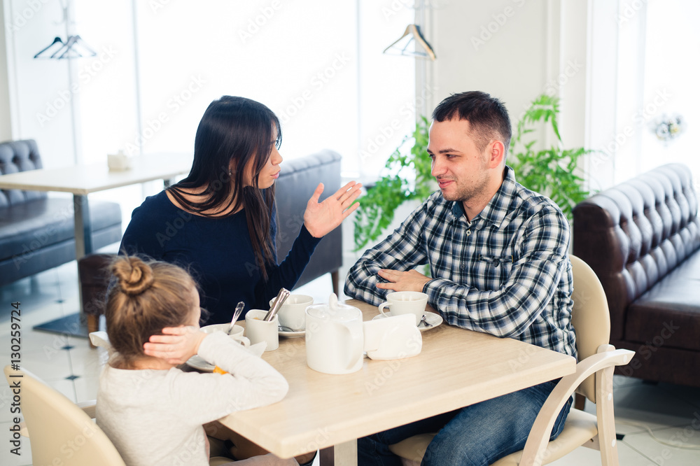 Little girl doesn't want to hear arguing of parents Little girl doesn't want to hear arguing of parents