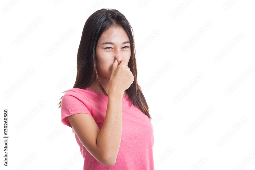 Young Asian woman holding her nose because of a bad smell.. Young Asian woman holding her nose because of a bad smell..