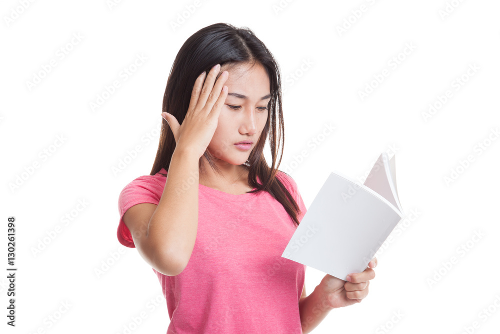 Young Asian woman got headache read a book. Young Asian woman got headache read a book.