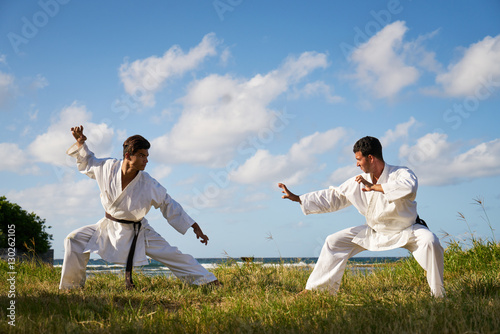 Men Kicking Punching Fighting During Combat Sport Karate Simulat