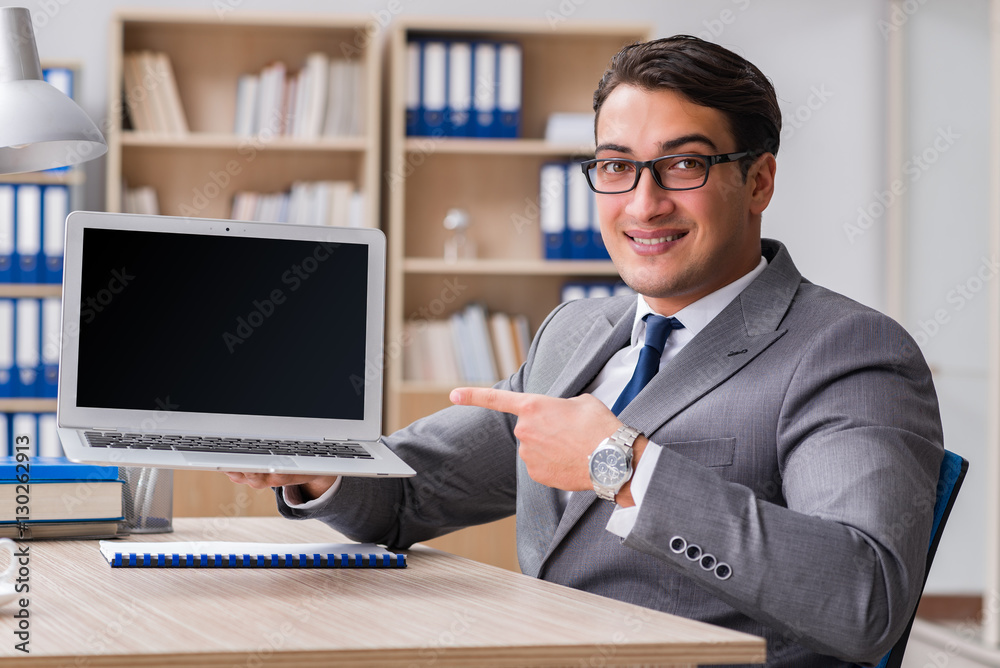 Young handsome businessman working on office Young handsome businessman working on office