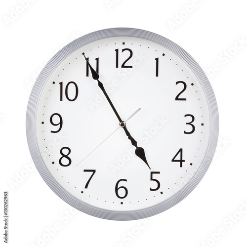 Office round clock shows almost five hours