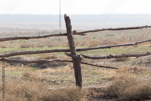 Obraz na płótnie wooden stick on the fence