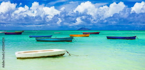 Wall Mural old rustic fishermen' boats in turquoise sea