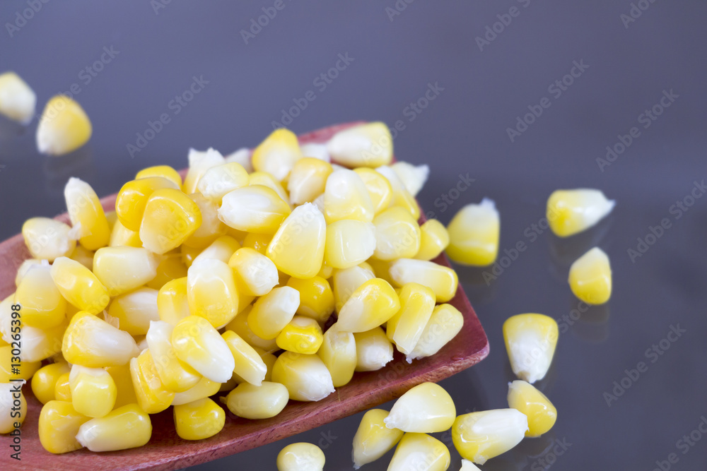 Fototapeta premium Corn on the wooden ladle