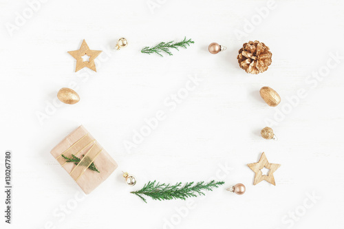 Christmas composition. Gift, christmas decoration, cypress branches, pine cones. Flat lay, top view