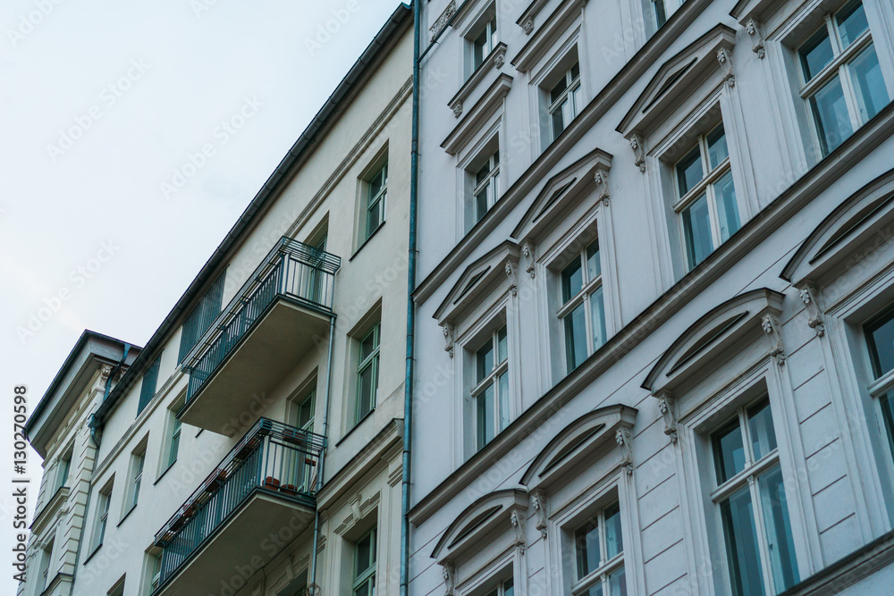 typical row houses at berlin prenzlauer berg with white facade