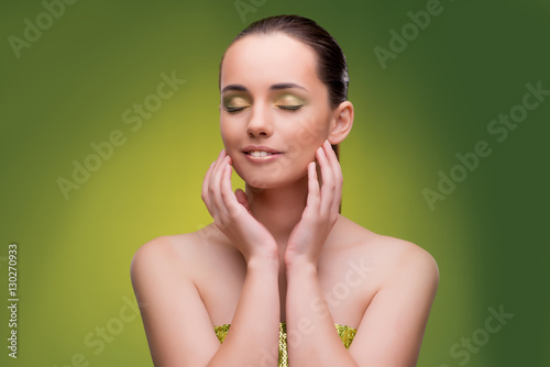 Beautiful woman on green background