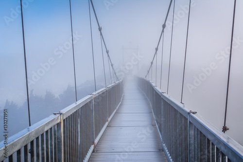 The Mile High Swinging Bridge in fog, at Grandfather Mountain, N © jonbilous