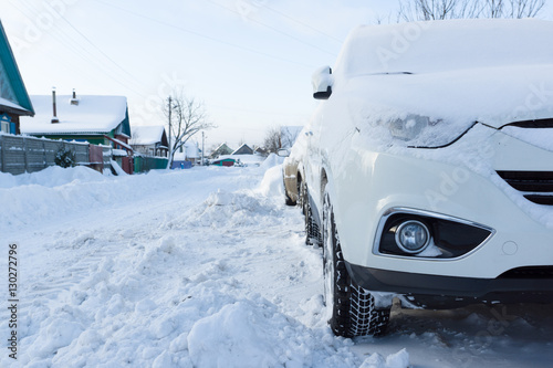 white car in the snow